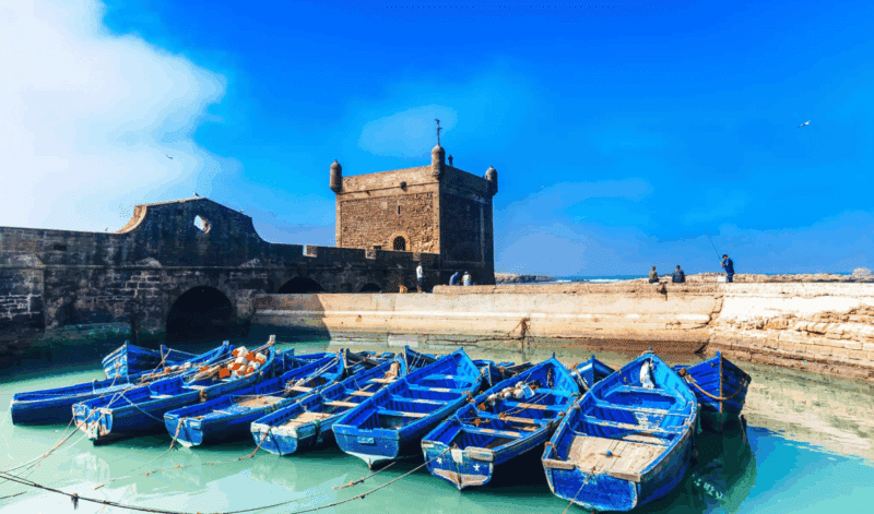 Blue fishing boats in the historic harbour of Essaouira, Morocco