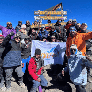 Climbers celebrating at Uhuru Peak on Mount Kilimanjaro, Tanzania
