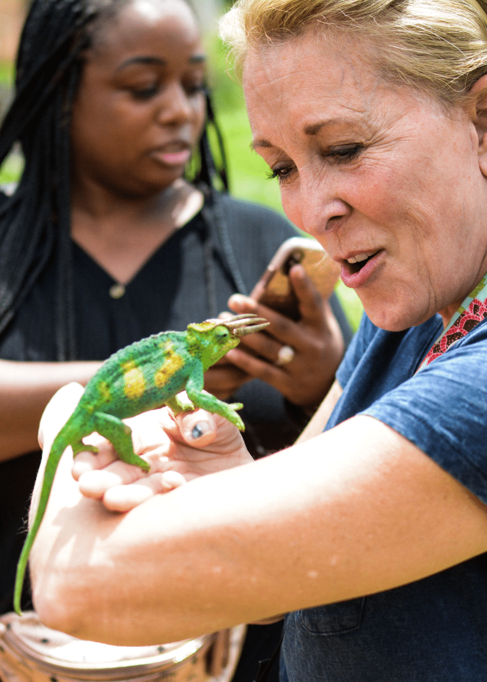 Do I need a visa for Uganda from the UK? - women with lizard