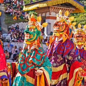 Performers dancers wearing masks in festival in Mongar Bhutan