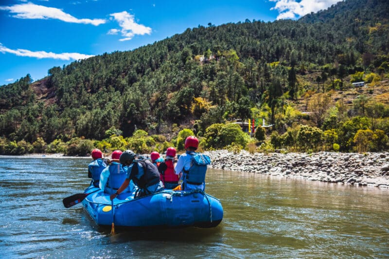 Punakha Bhutan Tourists ride on the rafting facility providing an interesting experience for travel enthusiasts