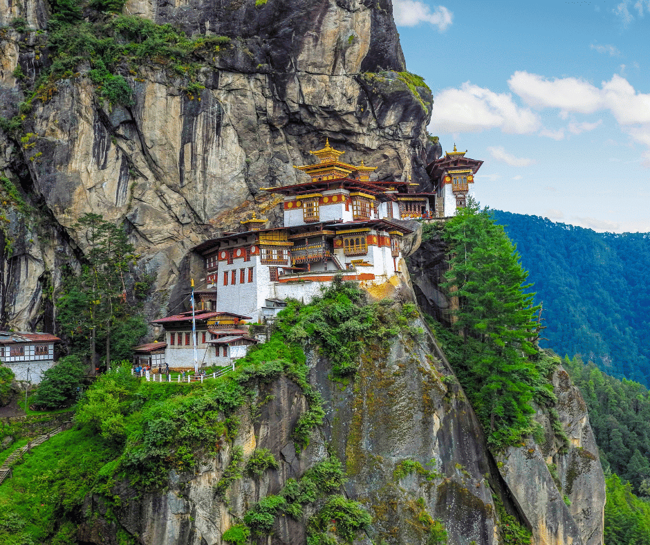 Tiger’s Nest Monastery perched on a dramatic cliffside above forested valleys in Bhutan