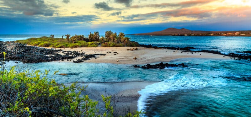 Pristine Galápagos Islands beach with turquoise water and volcanic coastline