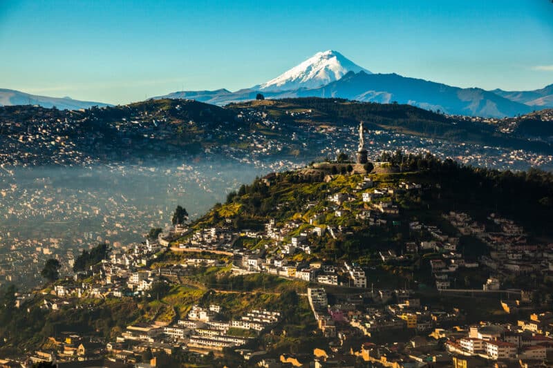 Quito city skyline with Cotopaxi volcano in the background, Ecuador