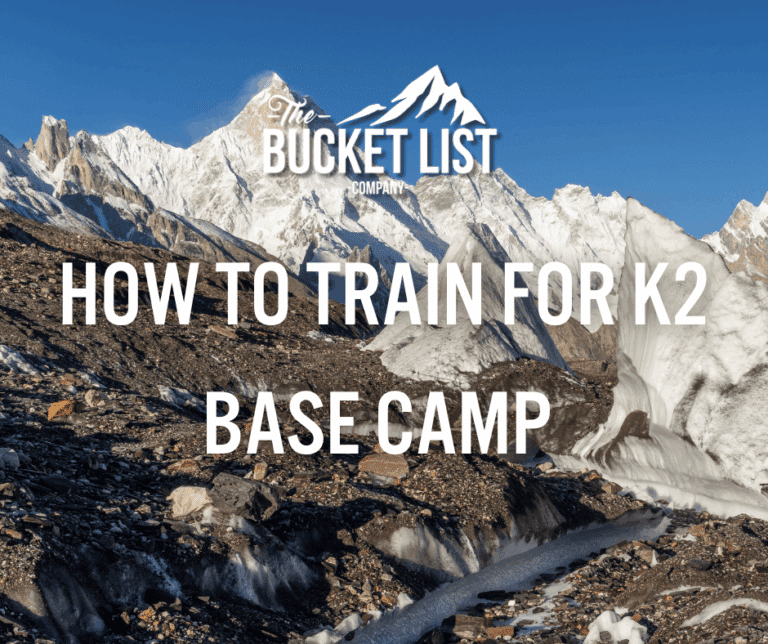 A rocky snow capped mountain landscape under a clear blue sky with text overlay: "The Bucket List Company Discover how to train for K Base Camp and prepare for the adventure of a lifetime