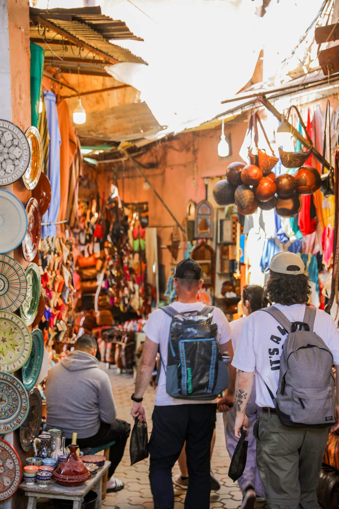 Walking through a colourful Moroccan market during the coastal adventure