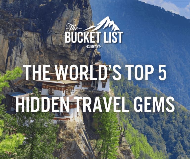 White text over a mountain landscape with a cliffside monastery reads: "The Bucket List Company The World’s Top Hidden Travel Gems " Discover lush greenery majestic peaks and secret escapes in this stunning scene
