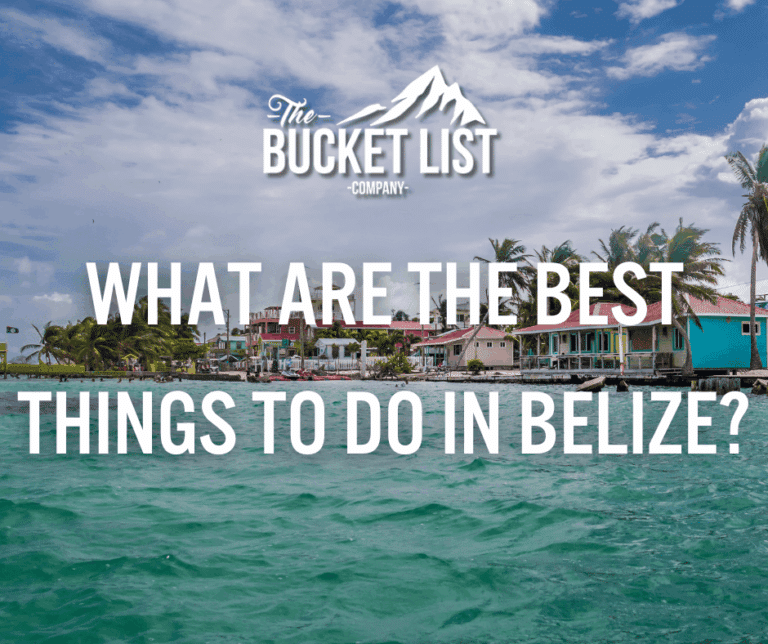 A colorful seaside village in Belize with palm trees and houses along the shore; text over the image reads “What Are the Best Things to Do in Belize?” with "The Bucket List Company" logo above