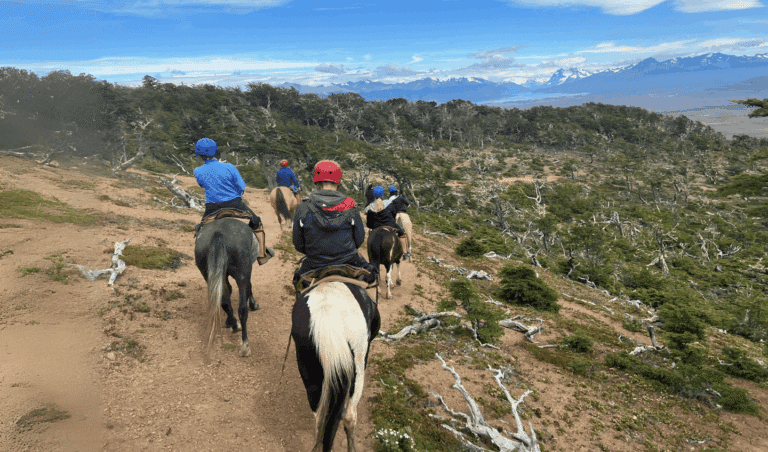 Horseback riding through Patagonian wilderness with mountain views on a Patagonia adventure