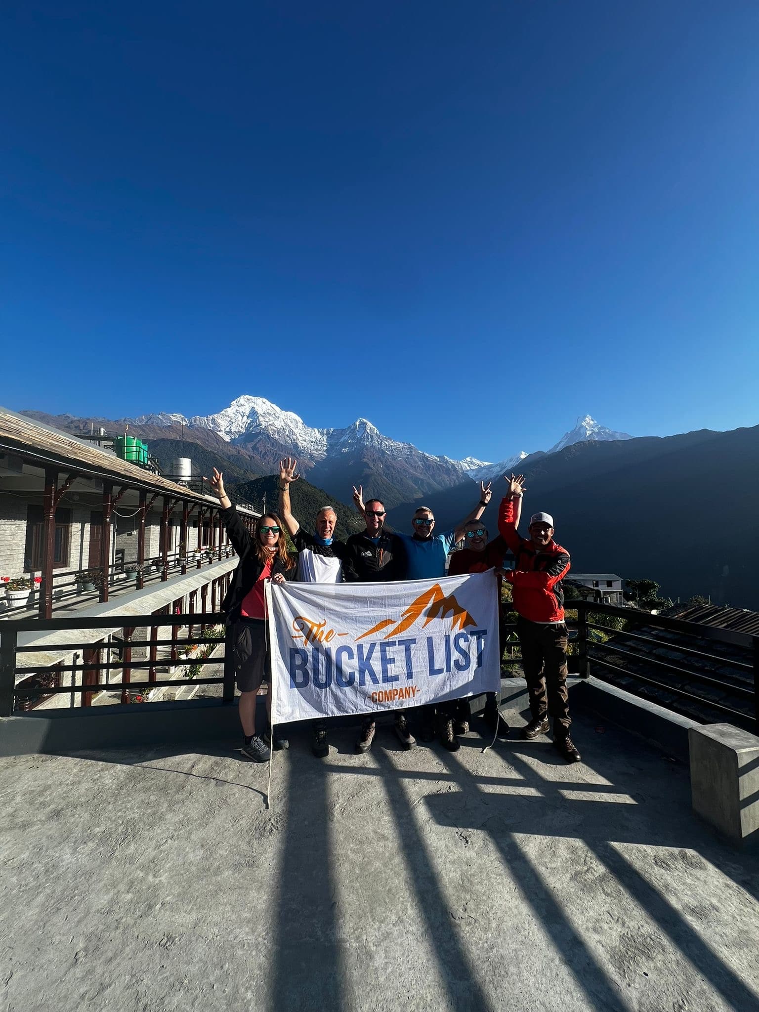 Bucket List Company trekkers posing at a viewpoint on the Annapurna Base Camp route
